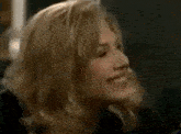a close up of a woman 's face with blonde hair