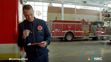 checking notes kelly severide taylor kinney chicago fire looking through notes