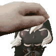 a close up of a person 's hand on top of a funko pop .