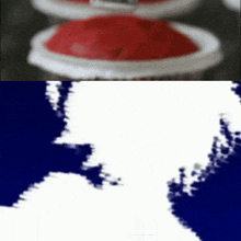 a close up of a cupcake with a blue background and a silhouette of a person