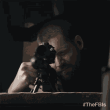 a man aiming a sniper rifle with the hashtag #thefbls on the bottom right