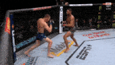two fighters in a boxing ring with espn on the corner