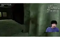 a man with a mustache is playing a video game with korean writing on the screen
