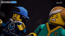two lego figures are standing next to each other on a screen that says bestv on the bottom