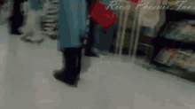 a blurry picture of a person walking in a store with the words river phoenix fans written on the bottom