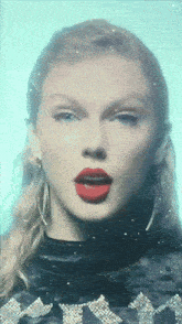 a close up of a woman 's face with red lipstick on