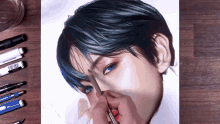 a person is drawing a woman 's face with blue hair
