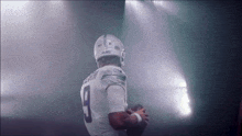 a football player with the number 9 on his shirt