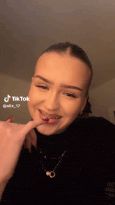 a woman with braces on her teeth is making a funny face