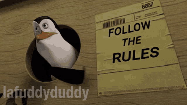 a penguin is standing next to a piece of paper that says 