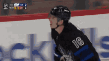 a hockey player with the number 18 on his back