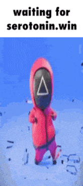 a cartoon character in a red suit with a triangle on his face is standing in the snow .