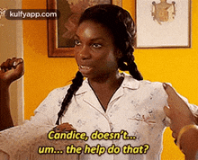 a woman in a white pajama shirt is talking to a man in a yellow room .