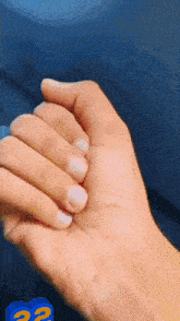 a close up of a person 's hand with a question mark on the bottom