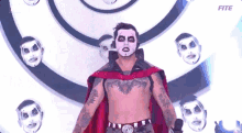 a man with a mask on his face is standing in front of a circle of masks .