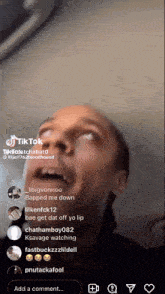 a man 's face is visible in a tik tok video