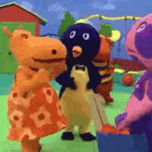 a group of stuffed animals are standing next to each other .