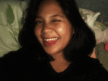 a woman with her eyes closed and her tongue hanging out