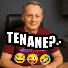 a man wearing a red shirt that says " tenant " sits at a desk