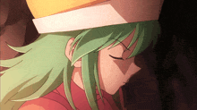a green haired anime character with a yellow hat