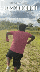 a man in a pink shirt and black shorts is running in a field with the words let 's gooooooo written on the bottom