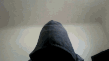 a person wearing a hoodie with a hood on their head