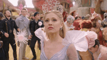 a woman in a fairy costume with a crown on her head