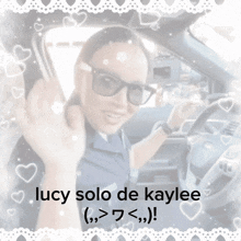 a picture of a woman in a car with the words lucy solo de kaylee below her