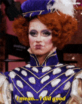 a drag queen in a purple and gold outfit says i mean i did good .