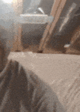 a person is sitting in a room with plastic covering the floor and ceiling .