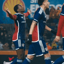 a soccer player wearing a jersey that says children stands on the field