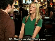 a woman in a green shirt says no that 's a no dick that 's a no!