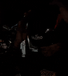 a man wearing a helmet that says motto on the front