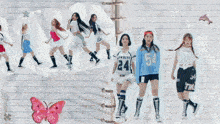 a group of girls are standing next to each other with one wearing a shirt with the number 12 on it