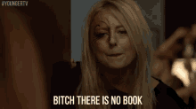a woman with face paint on her face is making a face and saying `` bitch there is no book '' .