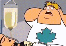 a cartoon character with a maple leaf on his shirt is holding a man in a hospital bed .