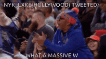 a man wearing a nyk lxke hollywood tweeted hat
