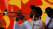 playing the trumpet koffee coachella playing music show