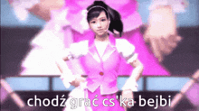 a girl in a pink suit is standing on a stage with the words chodz grac cs ka bejbi written below her
