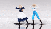 two anime figures are dancing with their arms outstretched and one has the letter n on her outfit