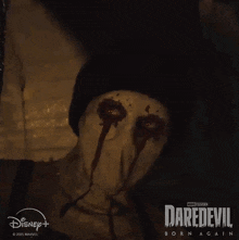 a poster for daredevil born again shows a person with blood dripping from their eyes .
