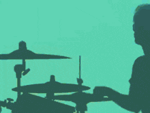 a silhouette of a woman holding a guitar in her hand