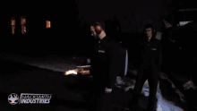 a man holding a torch with the words hacksmith industries written on the bottom