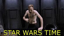 a man without a shirt is standing in front of a star wars time sign