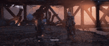 a video game character named taskmaster is standing in front of a destroyed building
