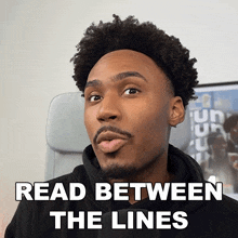 a man is reading between the lines and making a face