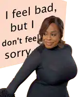 a woman stands in front of a sign that says i feel bad but i don t feel sorry