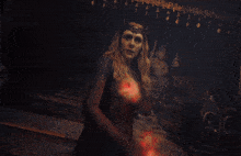 a man is surrounded by red flames coming out of his face