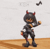 a cartoon character with horns is standing on a wooden floor holding a bomb .