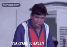 a man in a blue and red jacket with the words starttamilchat.in on the bottom